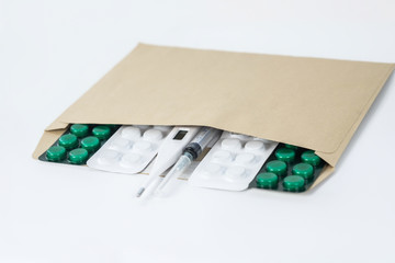 Close up picture of an envelope with medical stuff