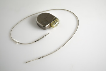 An Implantable Cardioverter Defibrillator or ICD pacemaker with leads. This is placed in the chest...