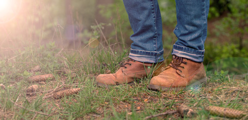 walking in the woods - mang shoes on grass