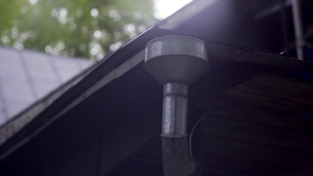 Roof drain gutter pipe for rain water. Tube made out of steel or copper or similar metal. The view from the top.