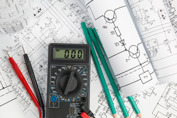 engineering electronic drawings, pencils and digital multimeter