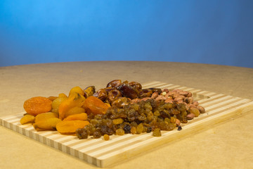 background of mixture of nuts and raisins, closeup