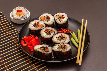 Korean roll Gimbap(kimbob). Steamed white rice (bap) and various other ingredients. Trendy black background