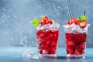 Red cocktail with ice and mint