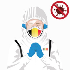 Covid-19 or Coronavirus concept. Belgian medical staff wearing mask in protective clothing and praying for against Covid-19 virus outbreak in Belgium. Belgian man and Belgium flag. Epidemic corona