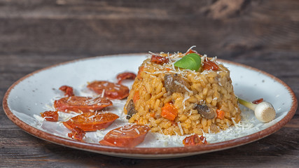 Rizotto chorizo parmesan blue plate wood