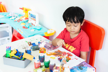 Children playing with watercolor stay at home. little boy and water colors.