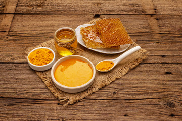 Spa concept. Self care with honey and turmeric. Natural organic cosmetics, homemade product, alternative lifestyle. Vintage background