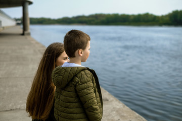 Mother and son on a walk in the Park on the embankment