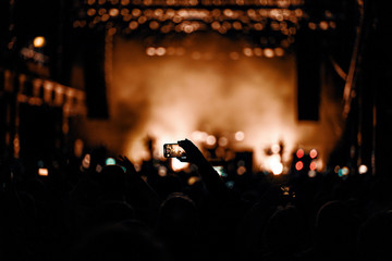Fototapeta na wymiar smartphone in concert crowd
