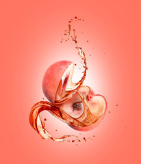 Juice splashes out from the cutted peach on a pink background © Krafla