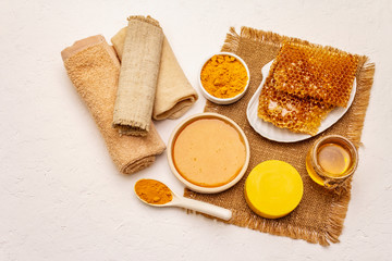 Spa concept. Self care with honey and turmeric. Natural organic cosmetics, homemade product, alternative lifestyle