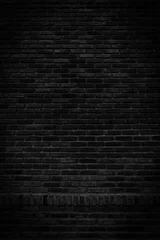 Photo sur Plexiglas Mur de briques Murs de briques noires qui ne sont pas enduits de fond et de texture. La texture de la brique est noire. Arrière-plan vertical du mur de sous-sol en brique vide.