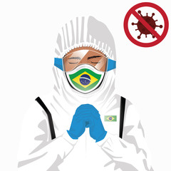 Covid-19 or Coronavirus concept. Brazilian medical staff wearing mask in protective clothing and praying for against Covid-19 virus outbreak in Brazil. Brazilian man and Brazil flag. Epidemic virus