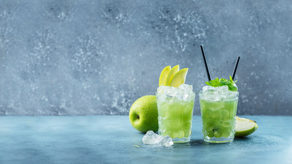 Green cocktail with ice and mint