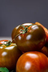 Fresh ripe sweet reddish brown and green kumato tomatoes