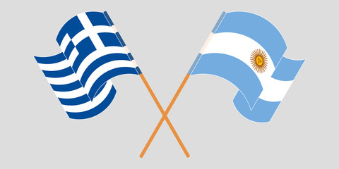 Crossed and waving flags of Greece and Argentina