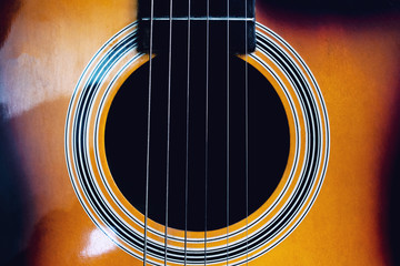 Darkness inside an acoustic guitar close up