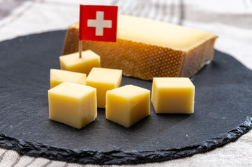 Block of Swiss medium-hard matured cheese gruyere used for baking, quiche, fondue, sandwiches
