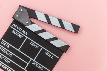 Fototapeta na wymiar Filmmaker profession. Classic director empty film making clapperboard or movie slate isolated on pink background. Video production film cinema industry concept. Flat lay top view copy space mock up