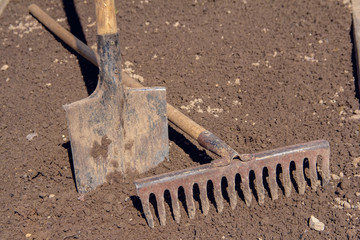 Hand shovel and rake. Garden tools before spring plantings. Hand Tools