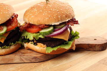 Tasty fresh meat burgers with salad and cheese. Homemade angus burger.