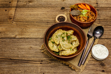 Dumplings stuffed stewed cabbage and sour cream. Traditional Ukrainian dish varenyky
