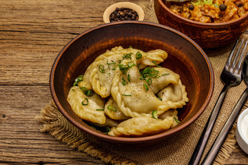 Dumplings stuffed stewed cabbage and sour cream. Traditional Ukrainian dish varenyky