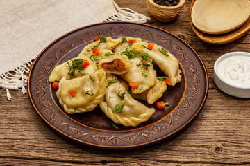 Dumplings stuffed stewed cabbage and sour cream. Traditional Ukrainian dish varenyky