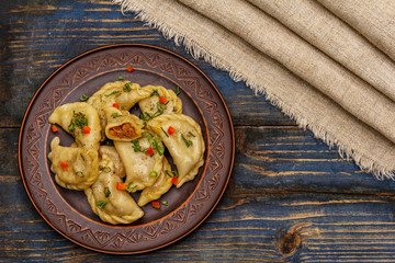 Dumplings stuffed stewed cabbage and sour cream. Traditional Ukrainian dish varenyky