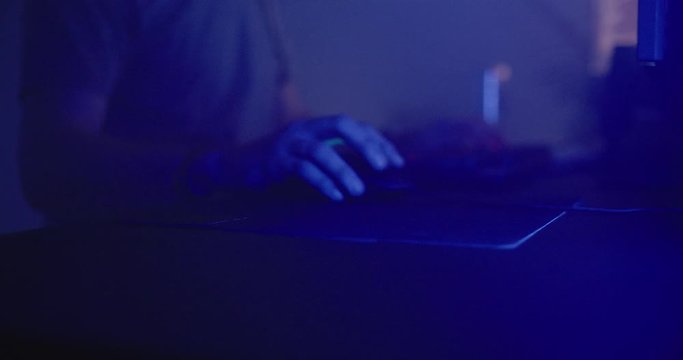 Man playing video games at night
