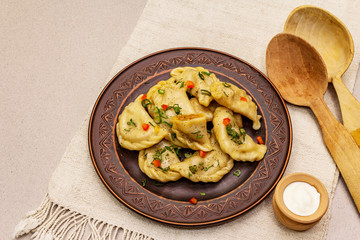 Dumplings stuffed stewed cabbage and sour cream. Traditional Ukrainian dish varenyky