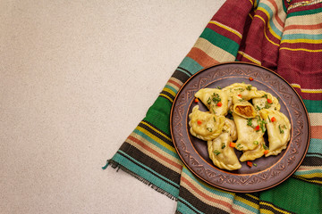 Dumplings stuffed stewed cabbage and sour cream. Traditional Ukrainian dish varenyky