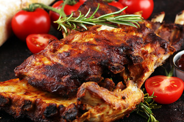 Grilled spare ribs for a tasty bbq meat with hot spicy barbecue sauce