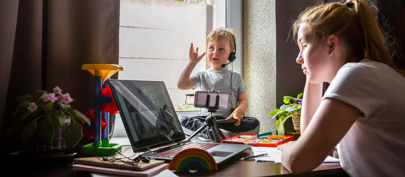 Coronavirus. Quarantine. Online training, distant remot work. Laptop and kid toys on the table. Work from home with children, home office. Workplace at home. Coronavirus pandemic in the world.Covid 19