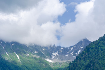 Beautiful view landscape of the Alps mountains in Italy with fog and snow