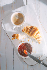 croissants with jam and coffee