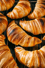 croissants on a baking rack cool after baking