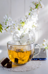 herbal tea and a telephone on the table