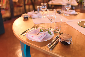 Table set for a wedding reception. Table decorations for wedding party. Wedding Setup.