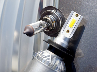 Close-up Halogen lamp and LED lamp for car headlights on the background of the headlight and body. 