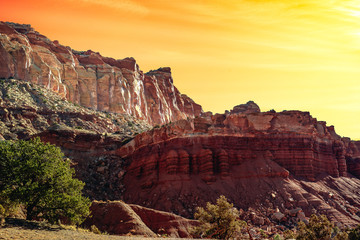 Sunset glow over the rock formations of Capitol Reef National Park, Fruita, Utah USA.
