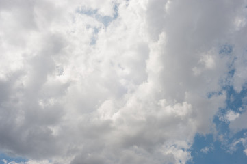 white clouds on a blue sky before a thunderstorm