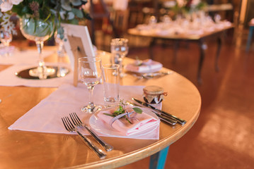 Table set for a wedding reception. Table decorations for wedding party. Wedding Setup.