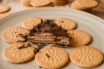 Delicious biscuit and chocolate cake. Homemade cake on biscuit background.  