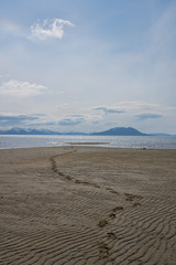 Footprints on an empty beach
