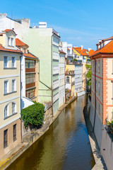 Fototapeta na wymiar Certovka - narrow canal under Charlse Bridge in Lesser Town, Prague, Czech Republic
