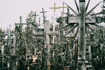 Atmospheric gothic panorama of vintage christian crosses all over the hill