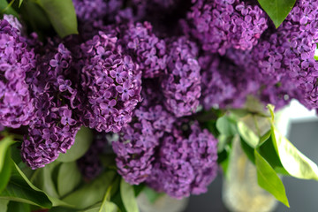 Blossoming branch of lilac on a white background
