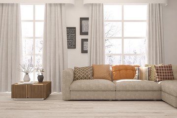 White living room with sofa and winter landscape in window. Scandinavian interior design. 3D illustration
